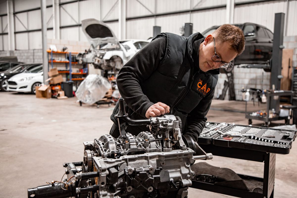 Local car repair experts in Peterborough – Smartfit Autos mechanic working on an engine